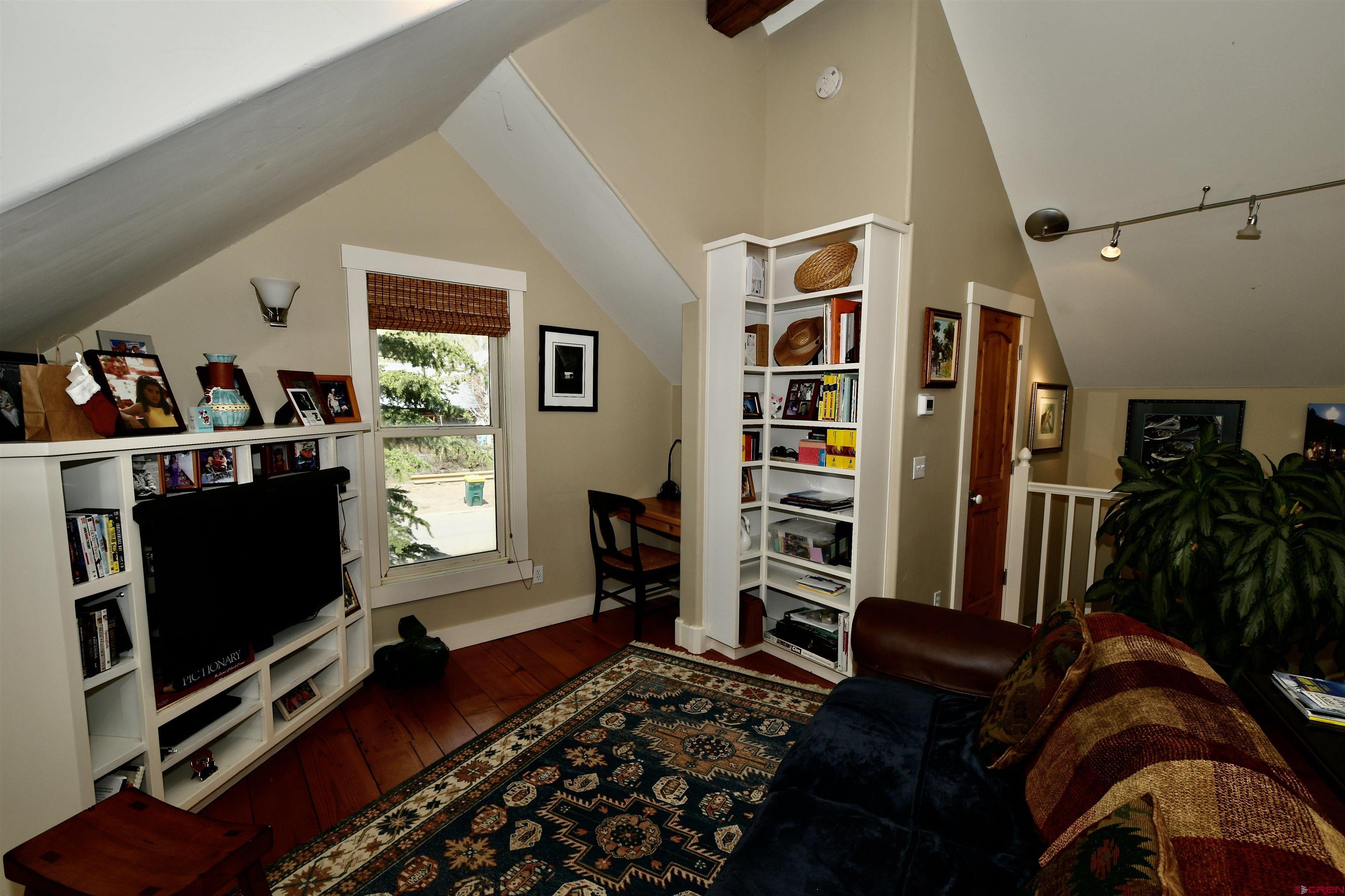 602-604 4th Street Crested Butte, CO 81224 - Photo 9 of 45 a living room with furniture and a flat screen tv
