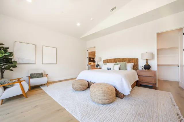 a bedroom with bed and window