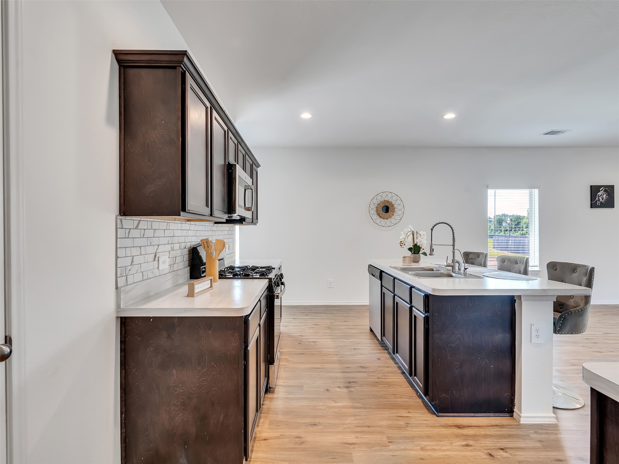 22503 Aspen Tarn Trail Spring, TX 77373 - Photo 11 of 30 a kitchen with a sink and cabinets