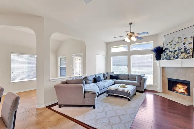 a living room with furniture and a fireplace