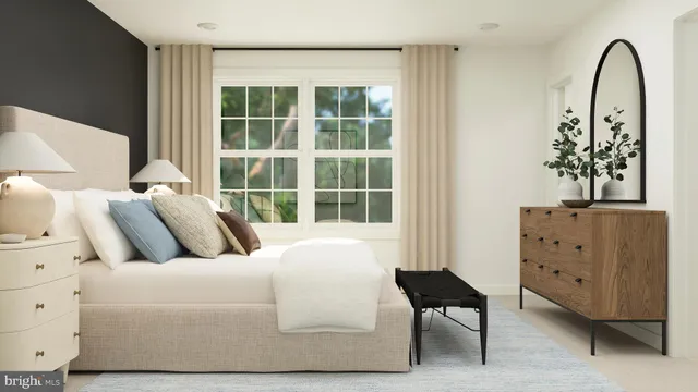 a bedroom with a bed and a dresser