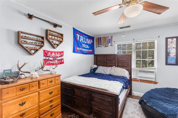 a bedroom with a bed and a window in it