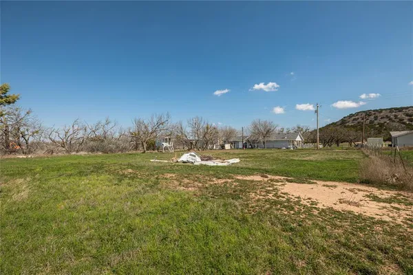 a view of lake with green space