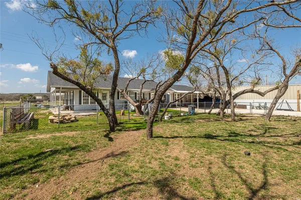 a view of yard with swimming pool