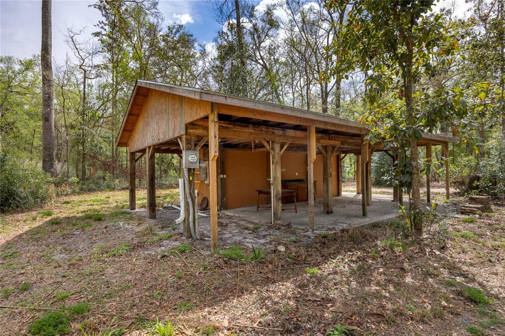 1187 Boston Road Fort White, FL 32038 - Photo 6 of 26 a view of a small house with a yard