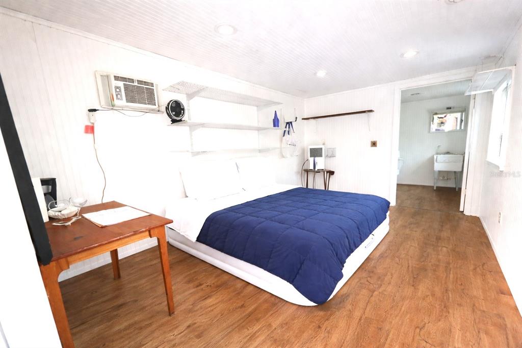 1187 Boston Road Fort White, FL 32038 - Photo 7 of 26 a bedroom with a bed and a table in it