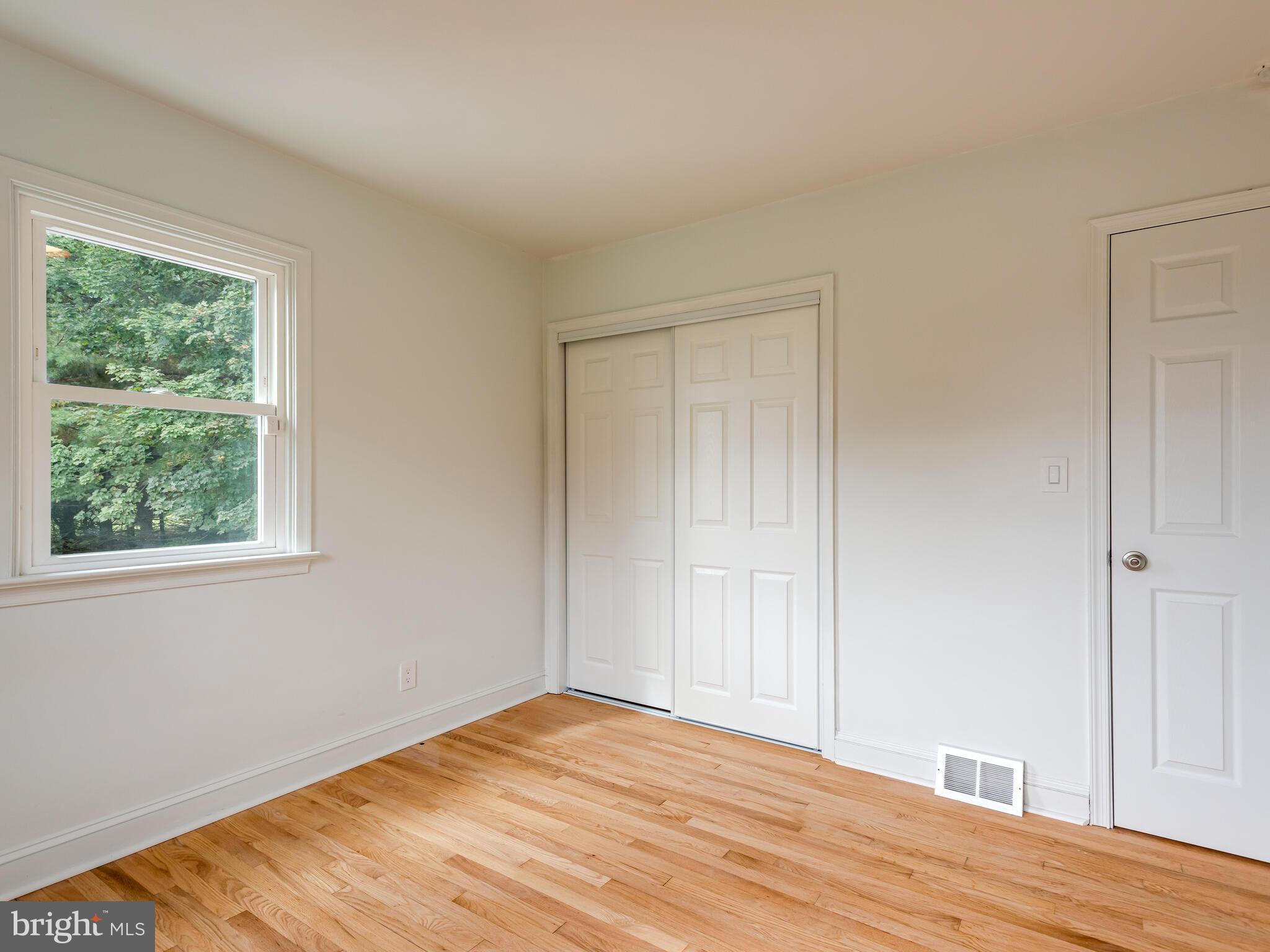 191 West Street Road Kennett Square, PA 19348 - Photo 24 of 41 a view of empty room with wooden floor and fan