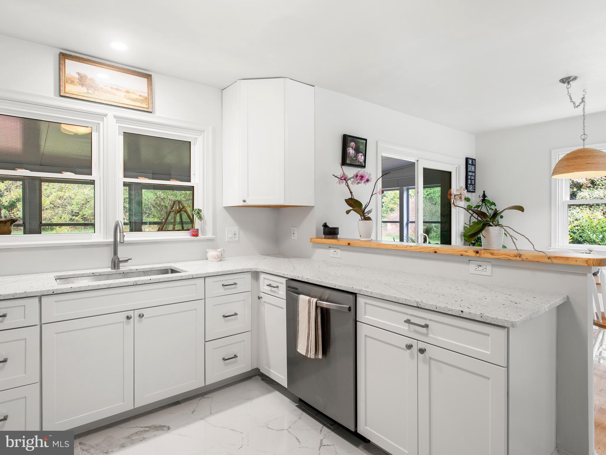 191 West Street Road Kennett Square, PA 19348 - Photo 5 of 41 a kitchen with white cabinets and sink
