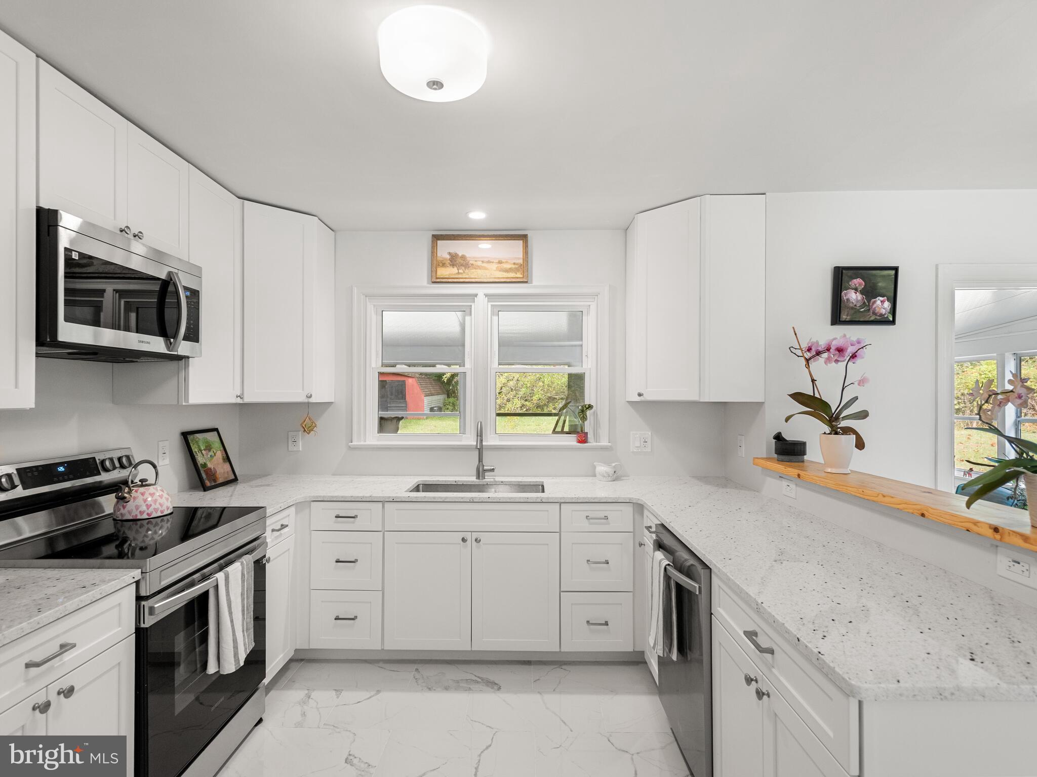 191 West Street Road Kennett Square, PA 19348 - Photo 6 of 41 a kitchen that has a sink and a stove in it