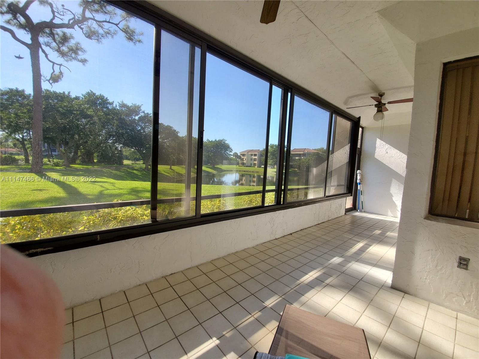 7472 La Paz Boulevard, Unit 104 Boca Raton, FL 33433 - Photo 1 of 44 a view of outdoor space with seating area