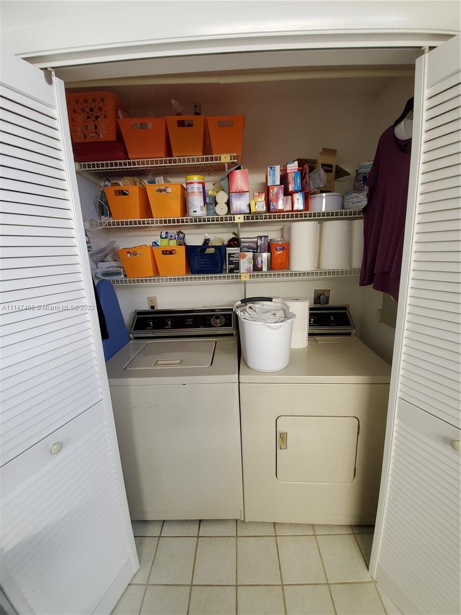 7472 La Paz Boulevard, Unit 104 Boca Raton, FL 33433 - Photo 11 of 44 a room with water heater and utility room