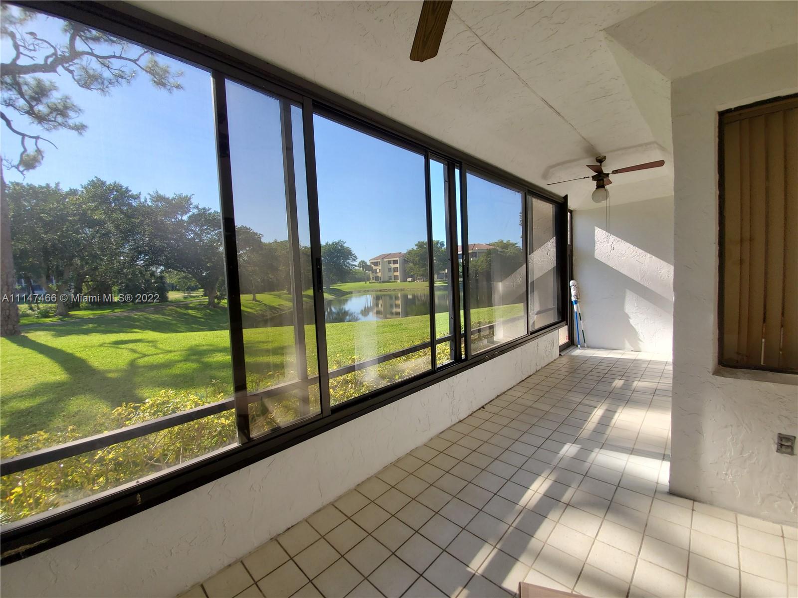 7472 La Paz Boulevard, Unit 104 Boca Raton, FL 33433 - Photo 25 of 44 a view of railway station with a porch