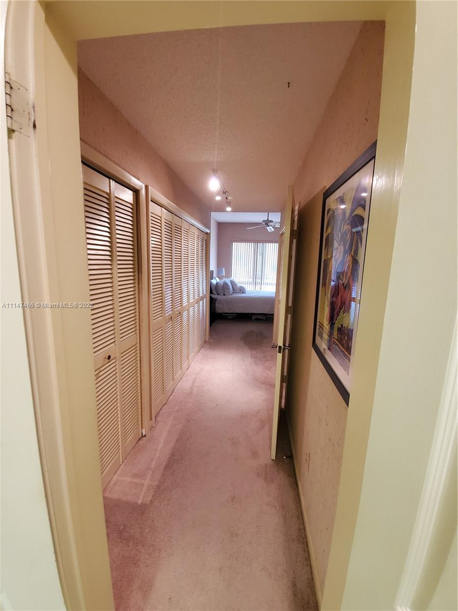 7472 La Paz Boulevard, Unit 104 Boca Raton, FL 33433 - Photo 35 of 44 a view of hallway with stairs