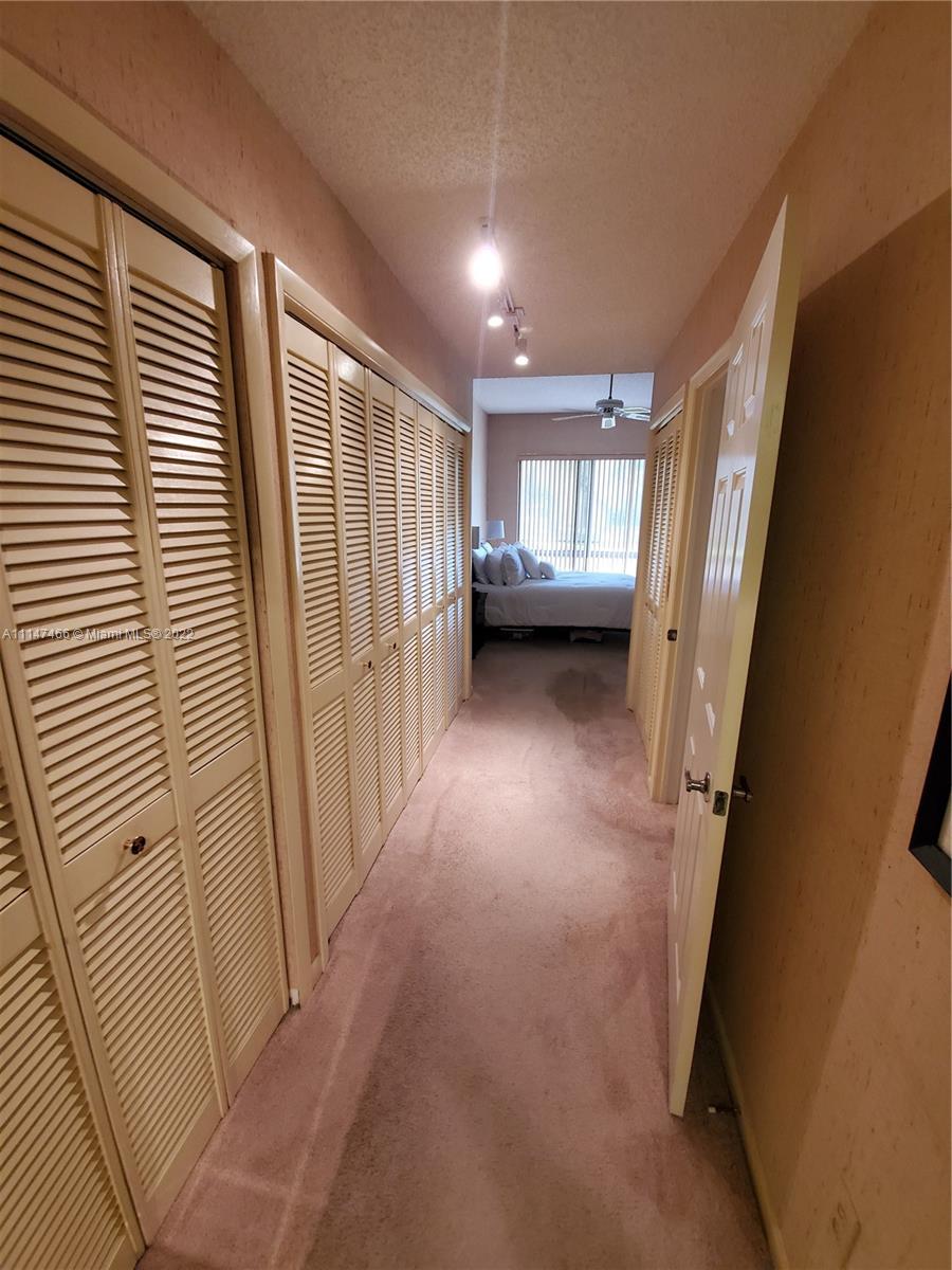 7472 La Paz Boulevard, Unit 104 Boca Raton, FL 33433 - Photo 36 of 44 a view of a livingroom with a staircase