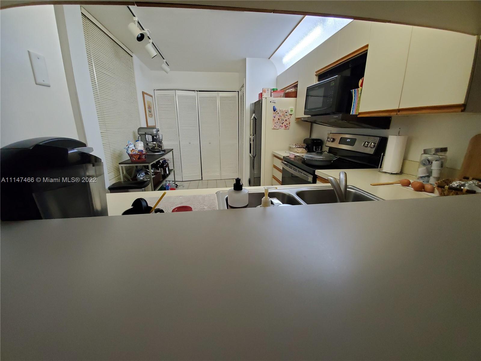 7472 La Paz Boulevard, Unit 104 Boca Raton, FL 33433 - Photo 9 of 44 a view of a room with gym equipment