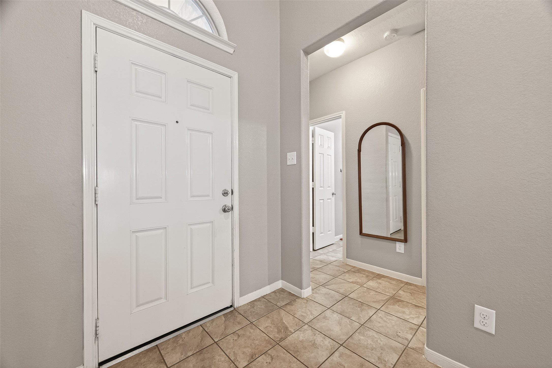 9110 Cavalier Lane Rosenberg, TX 77469 - Photo 5 of 30 Another view from the entryway. A hallway leads to secondary bedrooms and bathroom.