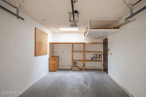 a backyard of a house with barbeque oven