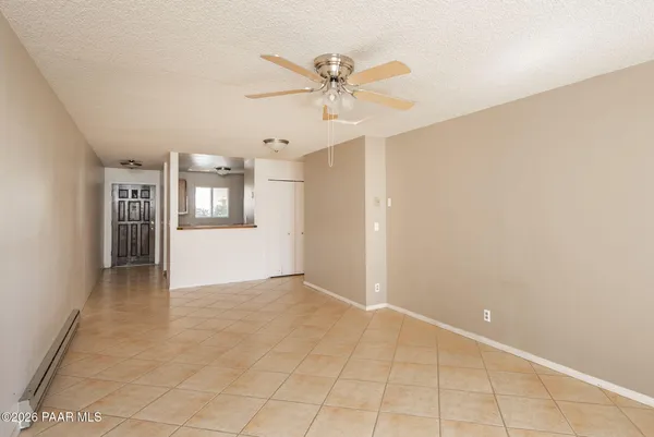 a view of an empty room and fire place