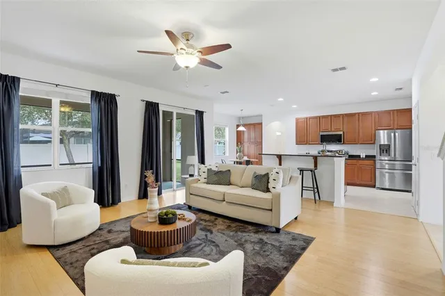 a living room with furniture and a large window