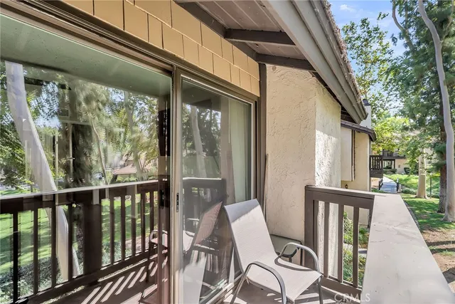 a view of balcony with furniture
