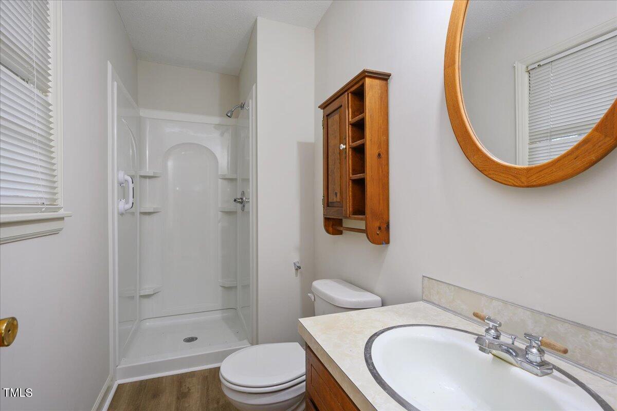 155 Barclay Road Durham, NC 27712 - Photo 6 of 23 a bathroom with a sink a toilet and shower