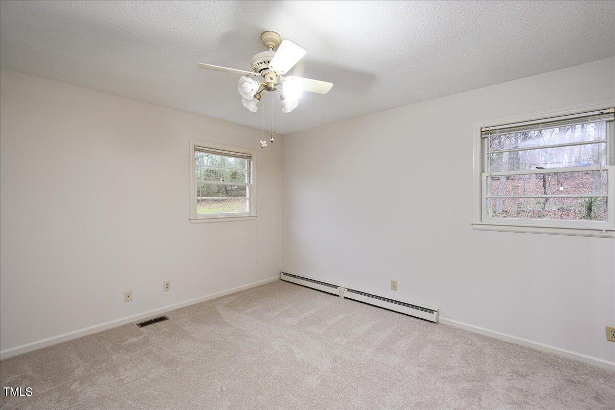 155 Barclay Road Durham, NC 27712 - Photo 8 of 23 an empty room with windows and fan