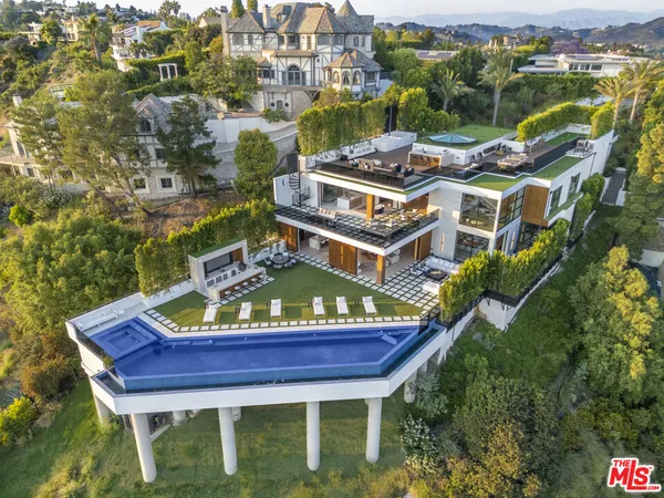 an aerial view of a house with a garden space