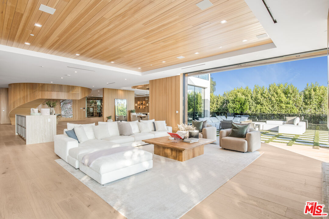 1033 Somera Road Los Angeles, CA 90077 - Photo 14 of 72 a living room with furniture and a large window