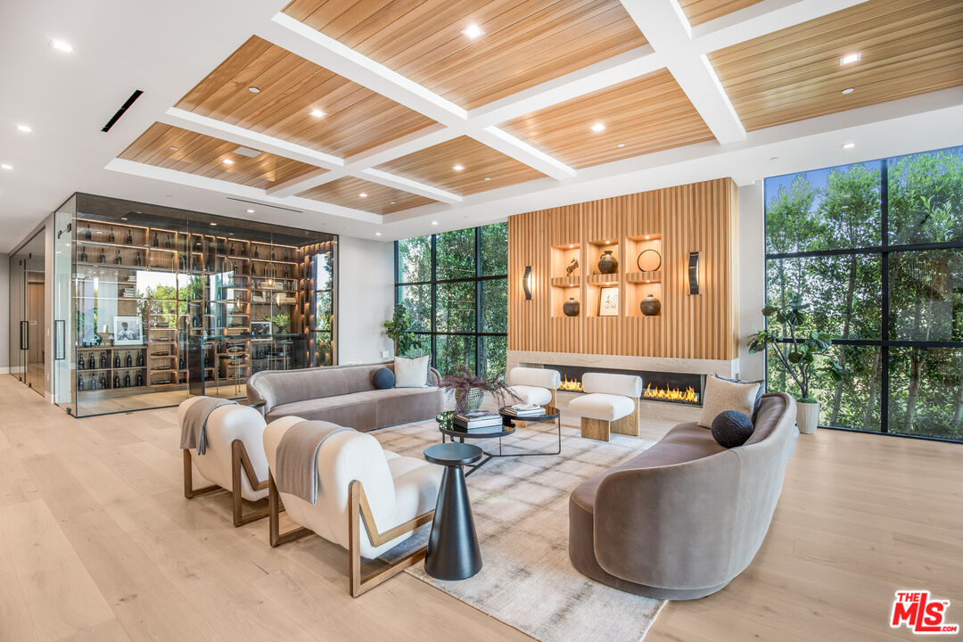 1033 Somera Road Los Angeles, CA 90077 - Photo 21 of 72 a living room with furniture and large windows