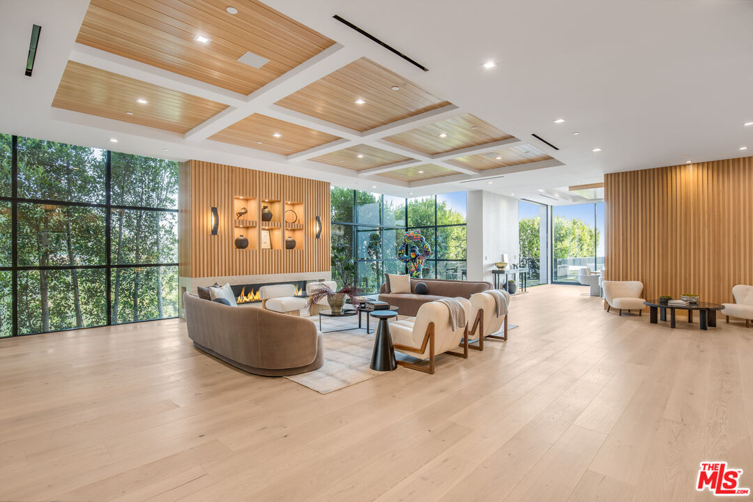 1033 Somera Road Los Angeles, CA 90077 - Photo 23 of 72 a living room with furniture and large windows