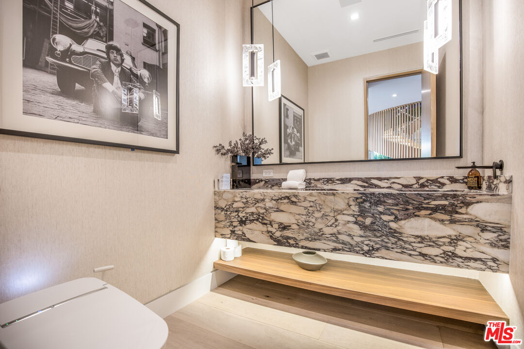 1033 Somera Road Los Angeles, CA 90077 - Photo 27 of 72 a bathroom with a toilet and a sink