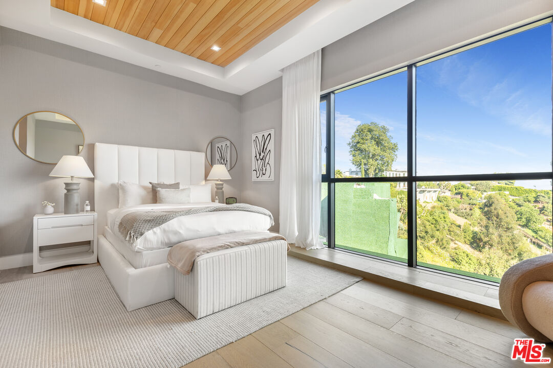 1033 Somera Road Los Angeles, CA 90077 - Photo 48 of 72 a bed room with a bed and a large window