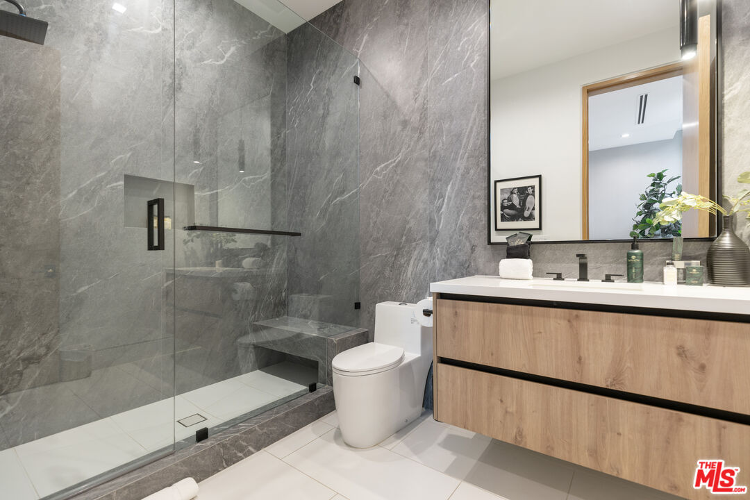 1033 Somera Road Los Angeles, CA 90077 - Photo 56 of 72 a bathroom with a sink toilet and shower