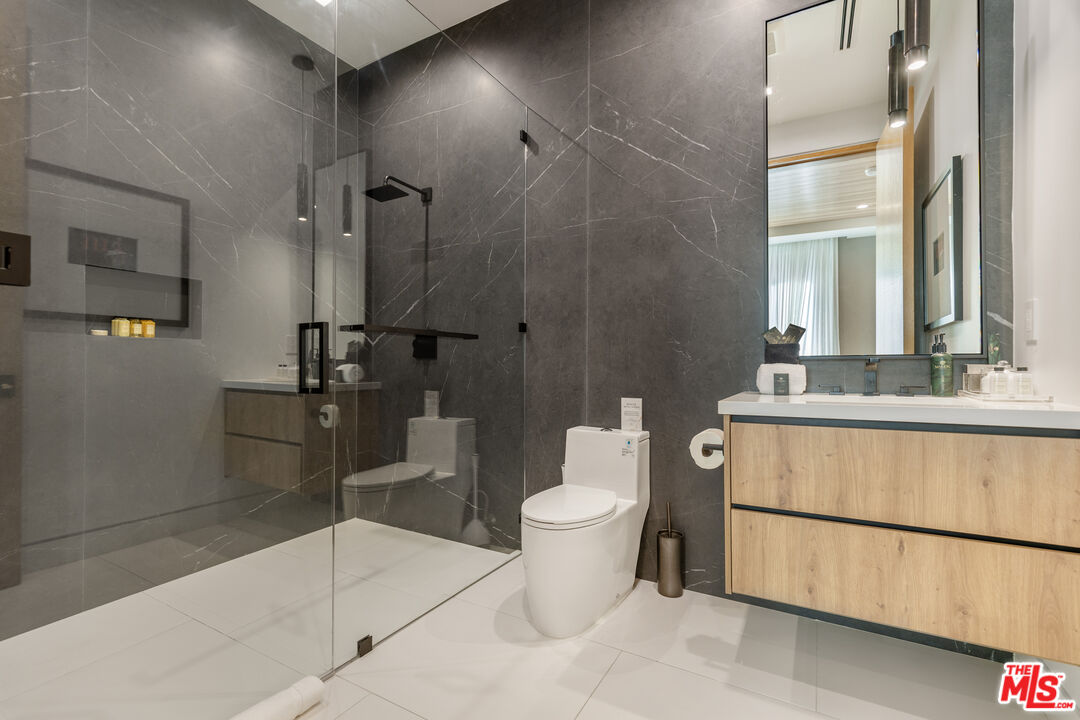 1033 Somera Road Los Angeles, CA 90077 - Photo 58 of 72 a bathroom with a sink toilet and shower