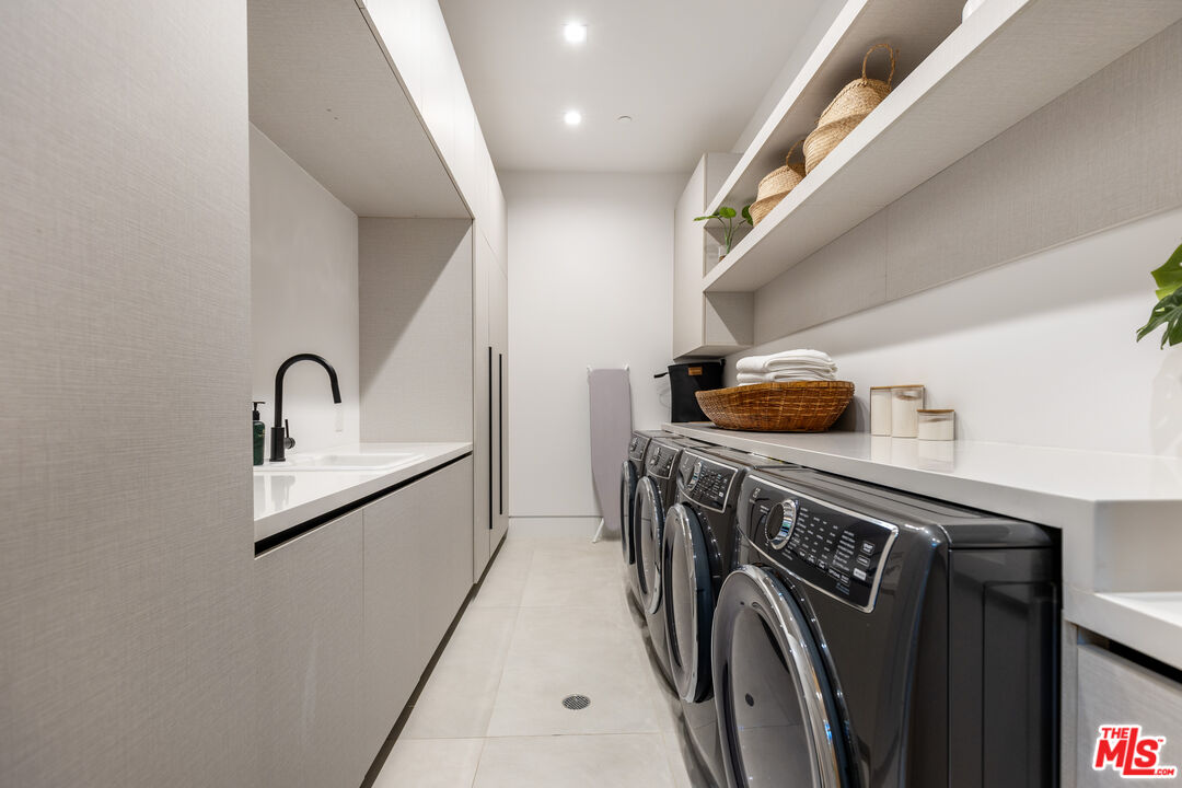 1033 Somera Road Los Angeles, CA 90077 - Photo 60 of 72 a utility room with dryer and washer