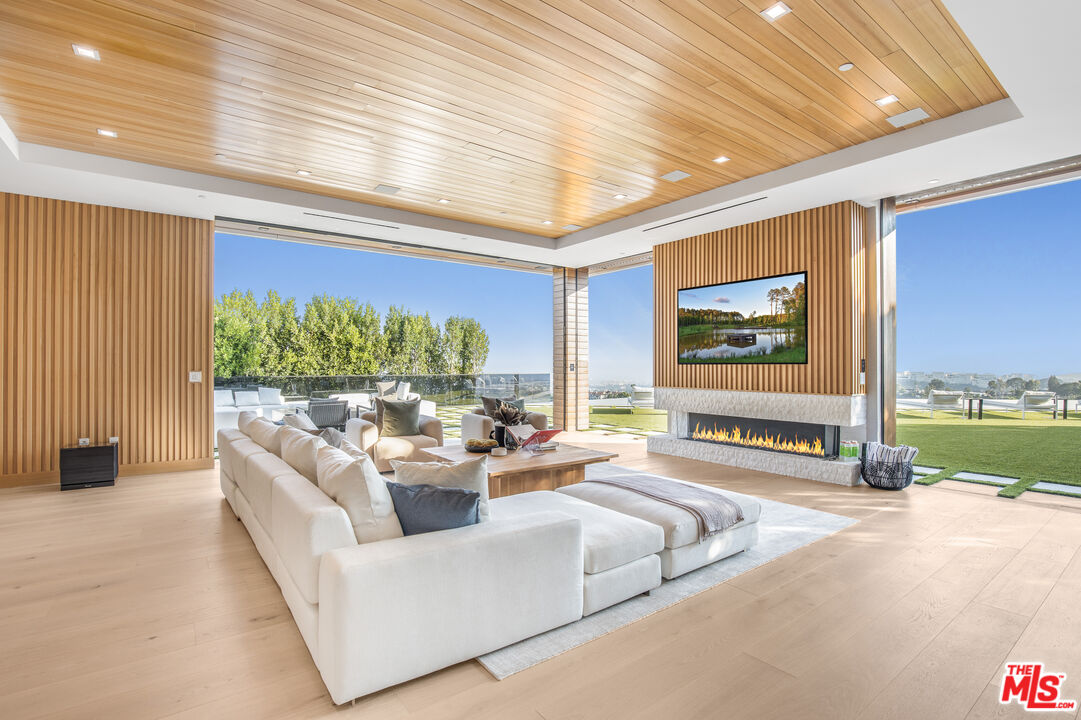 1033 Somera Road Los Angeles, CA 90077 - Photo 6 of 72 a living room with furniture and a large window