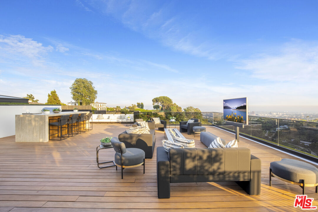 1033 Somera Road Los Angeles, CA 90077 - Photo 63 of 72 a view of a terrace with seating space