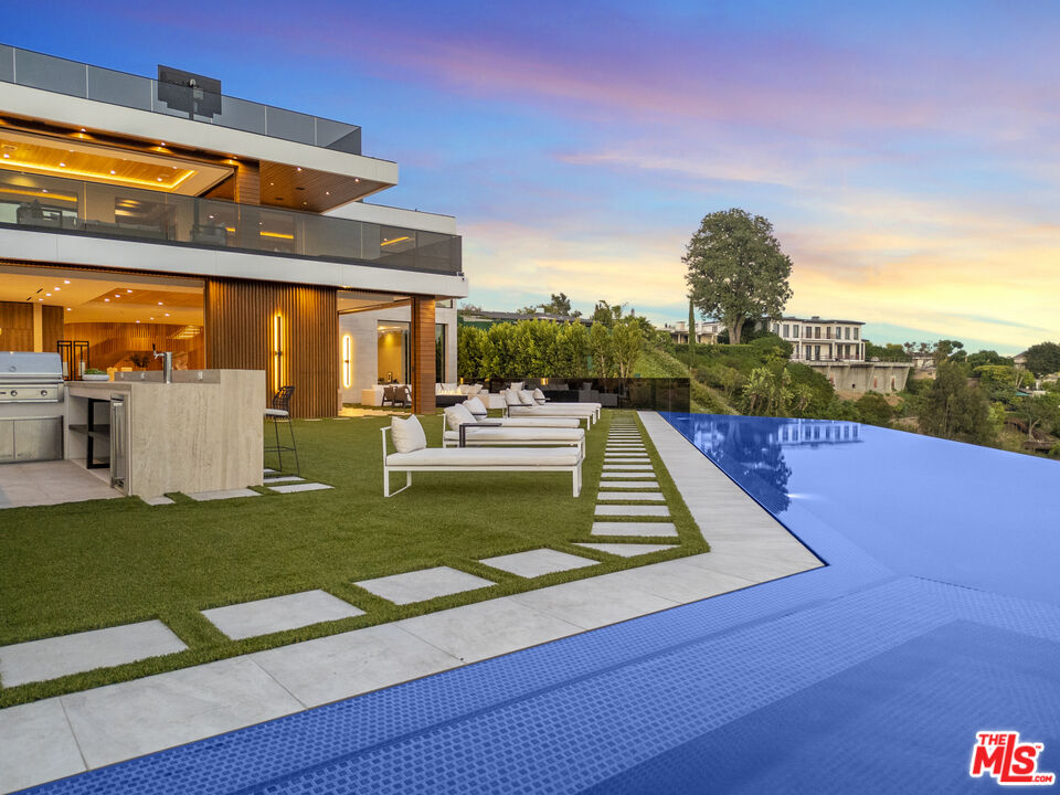 1033 Somera Road Los Angeles, CA 90077 - Photo 65 of 72 a view of a house with a yard