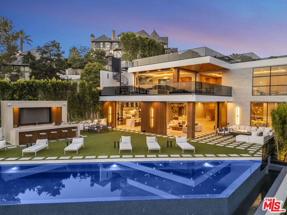 1033 Somera Road Los Angeles, CA 90077 - Photo 68 of 72 a view of a swimming pool with outdoor seating