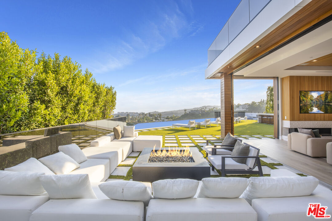 1033 Somera Road Los Angeles, CA 90077 - Photo 9 of 72 a outdoor living space with furniture and garden view