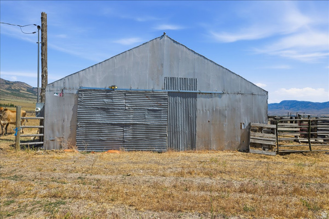 1634 West Arimo Road Arimo, ID 83214 - Photo 56 of 89 Corrugated metal barn structure with a pitched roof