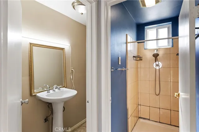a bathroom with a sink shower