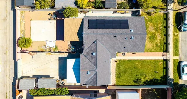 an aerial view of residential houses with outdoor space