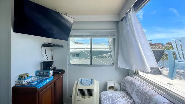 a bedroom with bed and a window