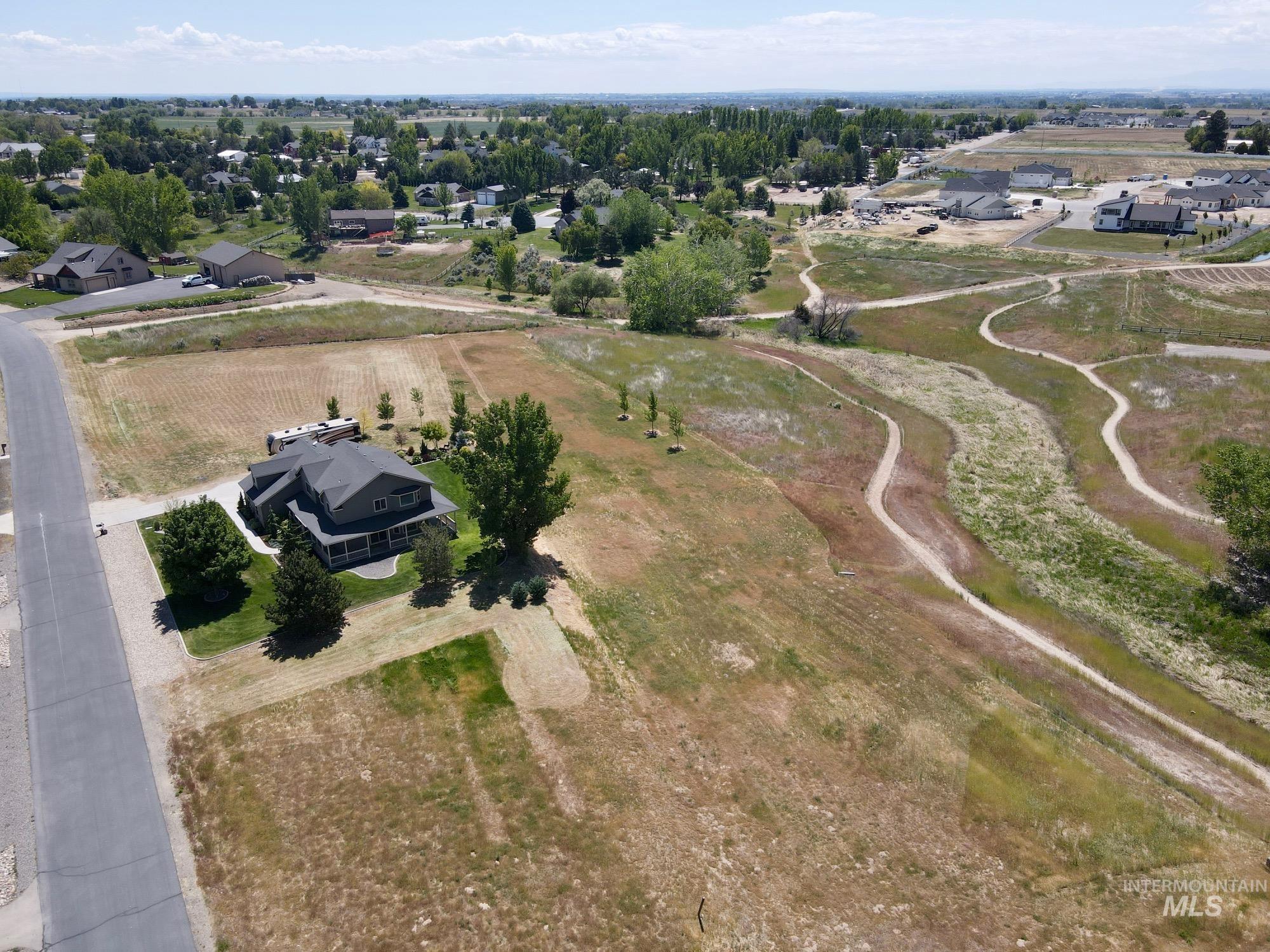 9299 Kemp Road Middleton, ID 83644 - Photo 49 of 50 Two-story residence featuring a covered front porch and a dark-colored roof