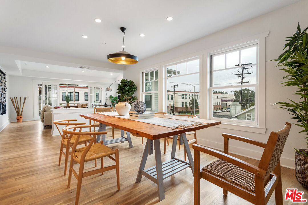 625 Diamond Street Redondo Beach, CA 90277 - Photo 18 of 42 a dining room with stainless steel appliances granite countertop a table chairs and a view of living room