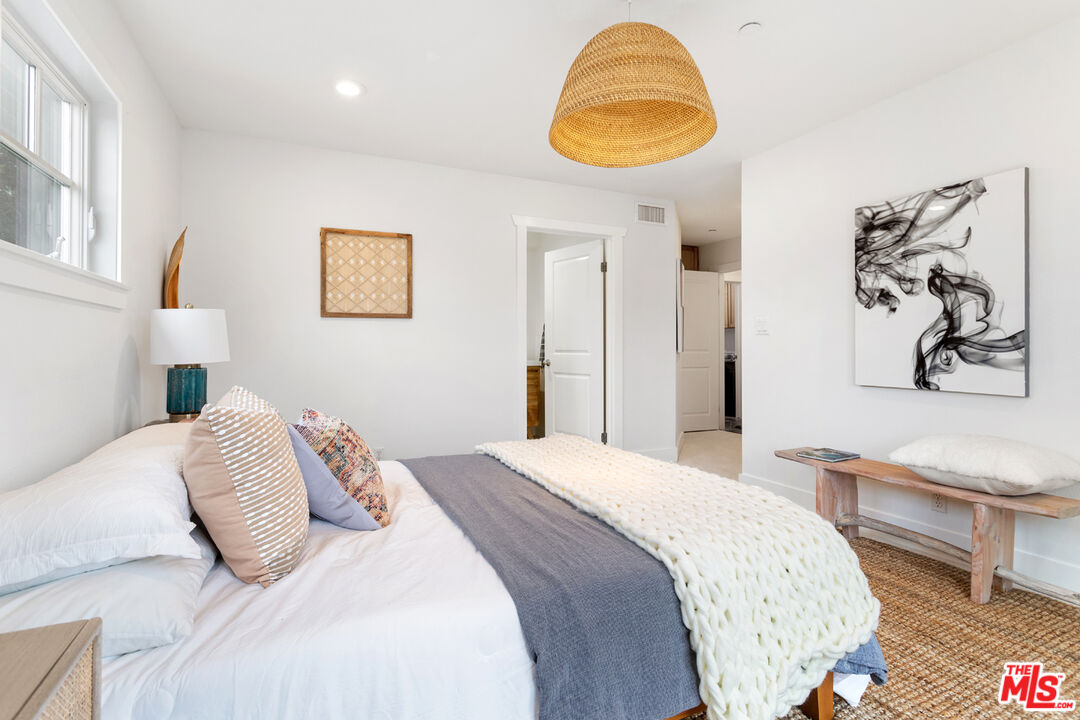 625 Diamond Street Redondo Beach, CA 90277 - Photo 32 of 42 a bedroom with a bed and a painting on the wall