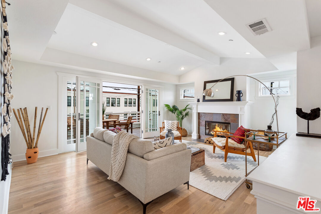 625 Diamond Street Redondo Beach, CA 90277 - Photo 6 of 42 a living room with furniture a fireplace and a flat screen tv