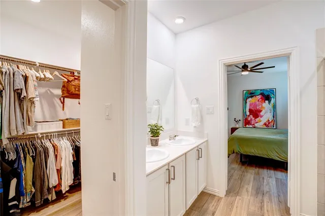 a bedroom with a bed and a potted plant