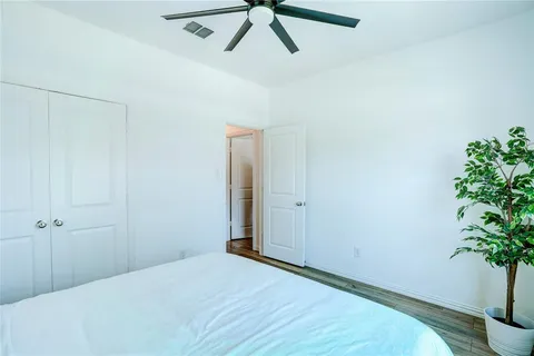 a view of a workspace with furniture and wooden floor